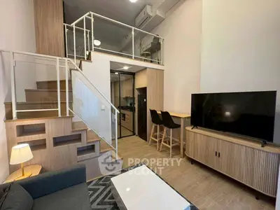 Modern loft apartment with stylish interior, open kitchen, and cozy living area.
