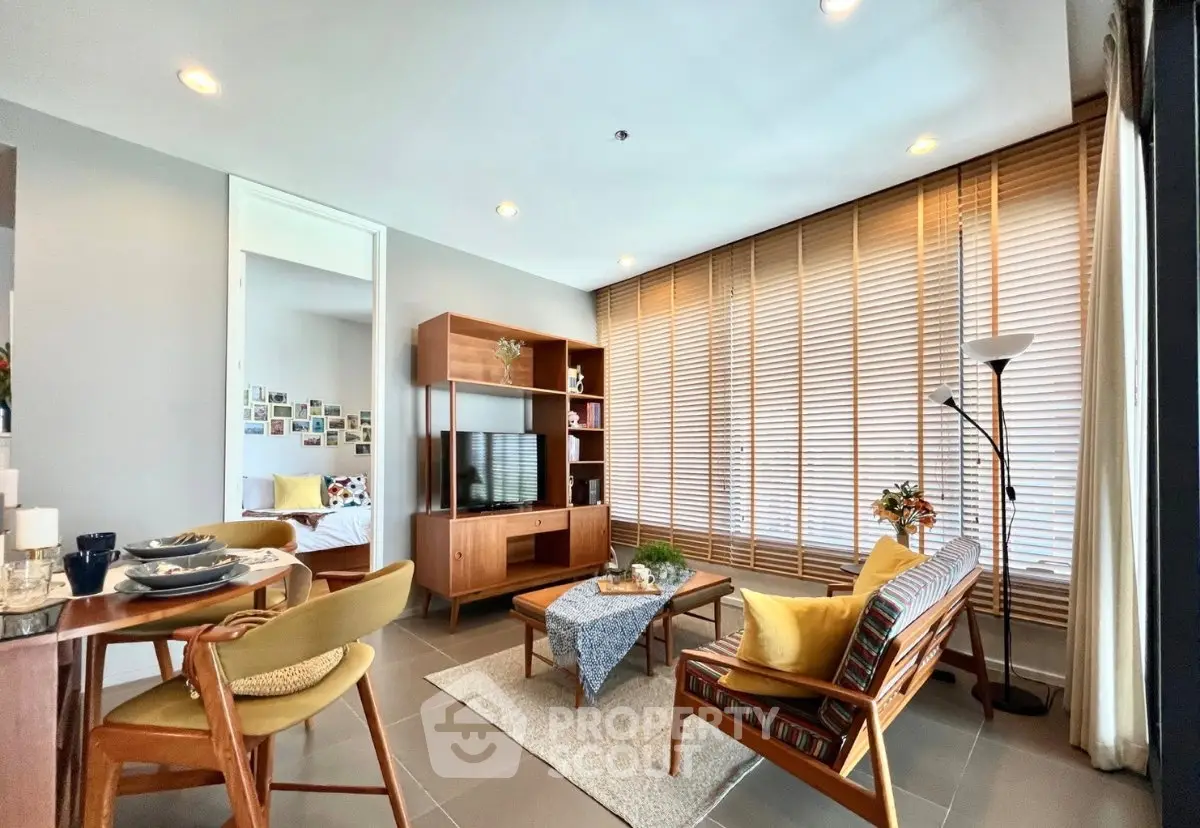 Stylish living room with modern furniture and large windows for natural light