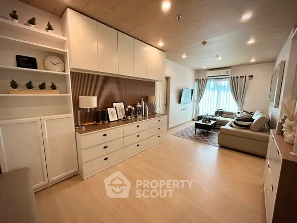 Spacious modern living room with elegant decor and ample natural light.