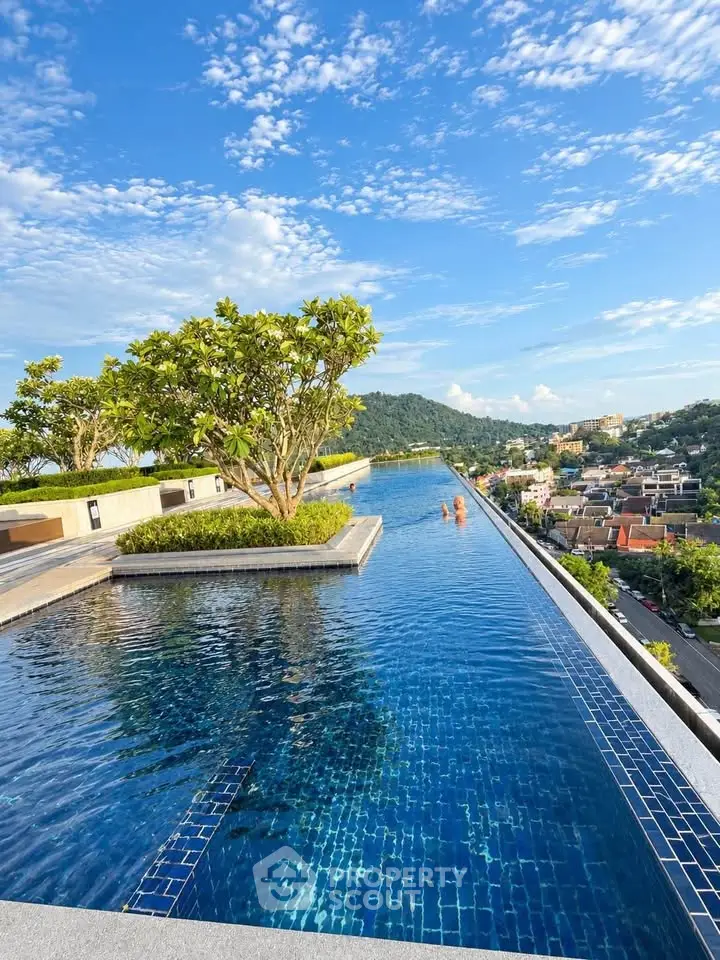 Stunning rooftop infinity pool with panoramic city and mountain views