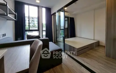 Modern studio apartment with sleek design and large windows for natural light
