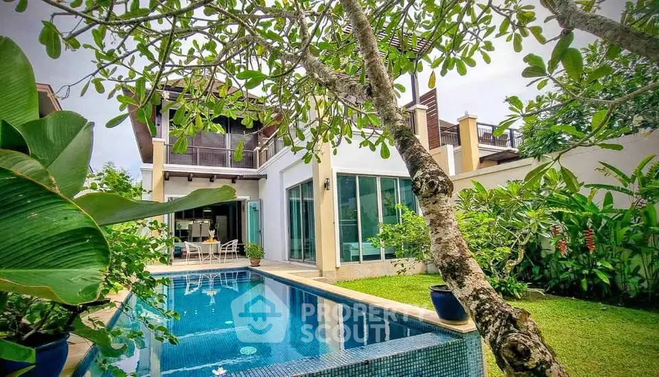 Luxurious villa with private pool and lush garden, perfect for tropical living.
