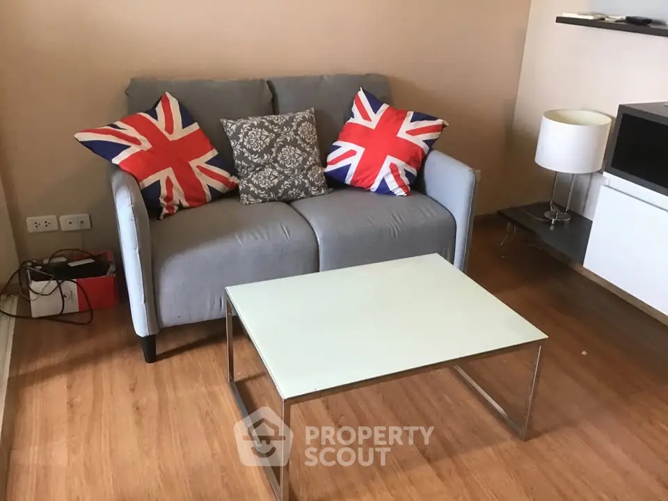 Cozy living room with Union Jack pillows and modern decor