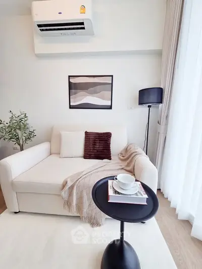 Modern living room with cozy sofa and stylish decor