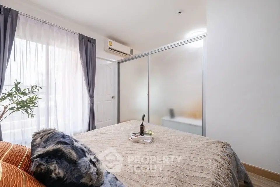 Cozy bedroom with frosted glass wardrobe and stylish decor