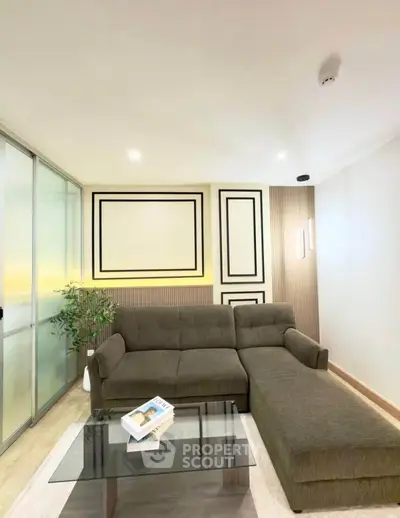 Modern living room with stylish sectional sofa and glass coffee table