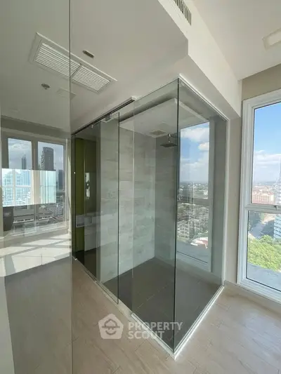 Modern bathroom with glass shower and city view in luxury apartment