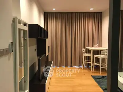 Modern living room with sleek furniture and cozy dining area