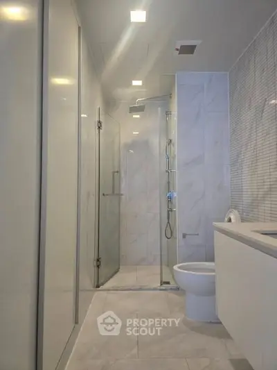 Modern bathroom with sleek design and glass shower enclosure