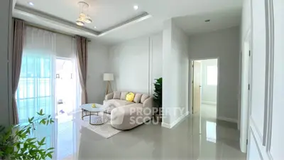 Bright and modern living room with elegant decor and natural light.
