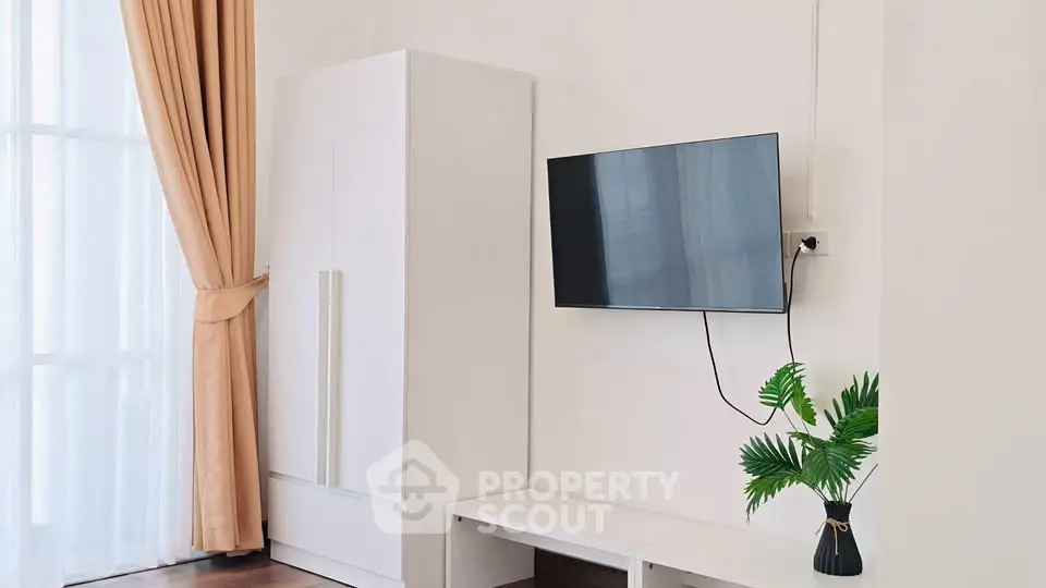 Modern living room with wall-mounted TV and elegant decor