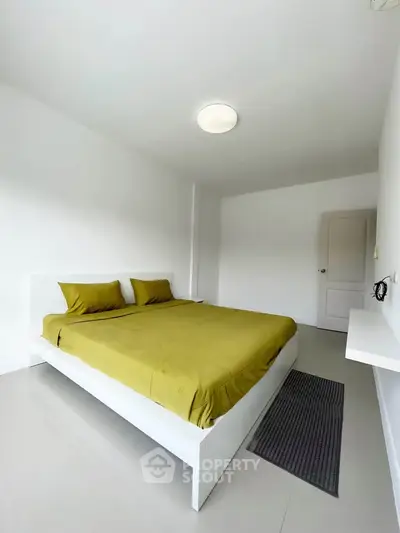 Spacious minimalist bedroom with modern design and natural light