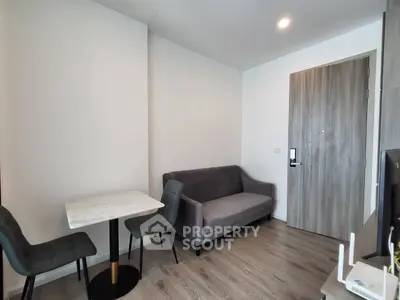 Modern living room with sleek furniture and wooden flooring