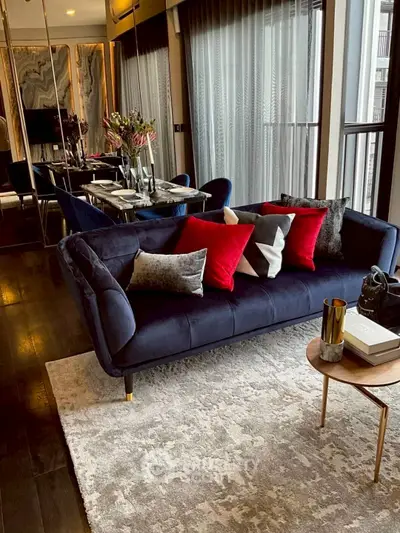 Luxurious living room with elegant decor and plush seating in modern apartment.