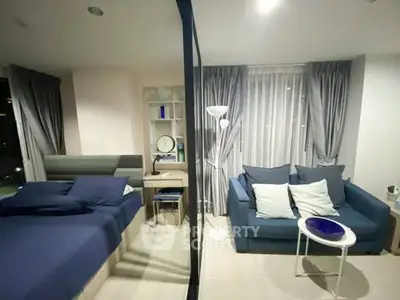 Modern bedroom with cozy sitting area and stylish decor