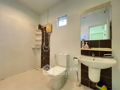 Spacious bathroom with modern fixtures and natural light