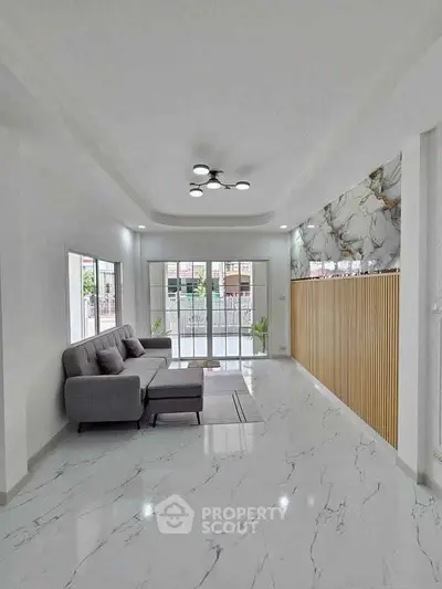 Modern living room with marble flooring and elegant decor