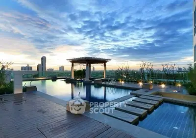 Luxurious rooftop pool with stunning city skyline views at sunset.