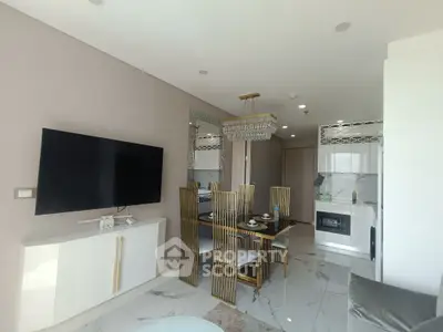 Modern living room with elegant dining area and sleek kitchen in open layout