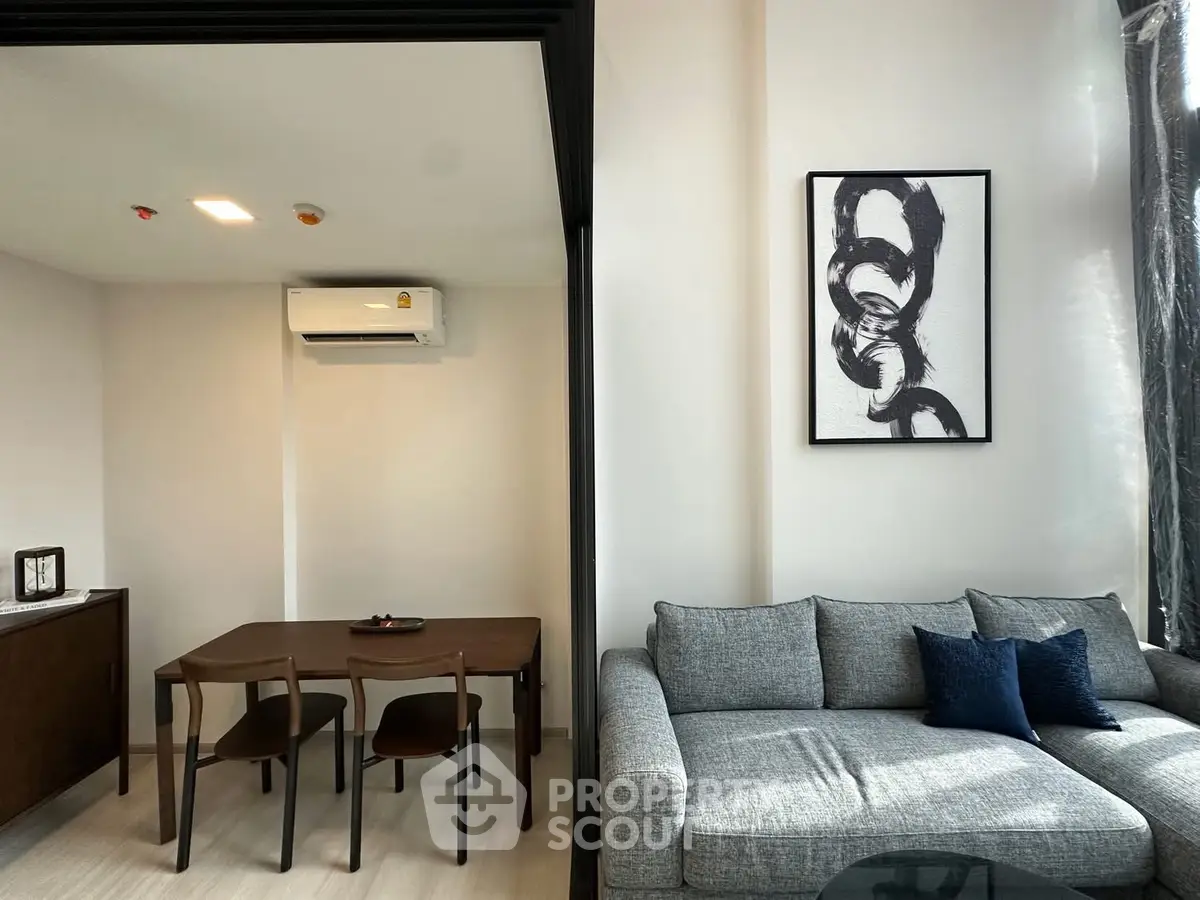 Modern living room with stylish furniture and contemporary art in a bright apartment.