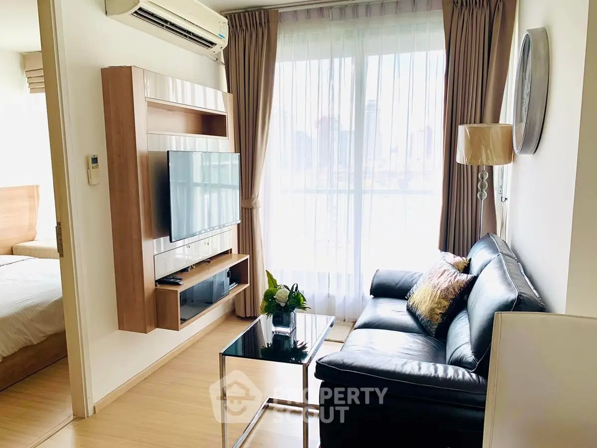 Modern living room with sleek furniture and city view, perfect for urban living.
