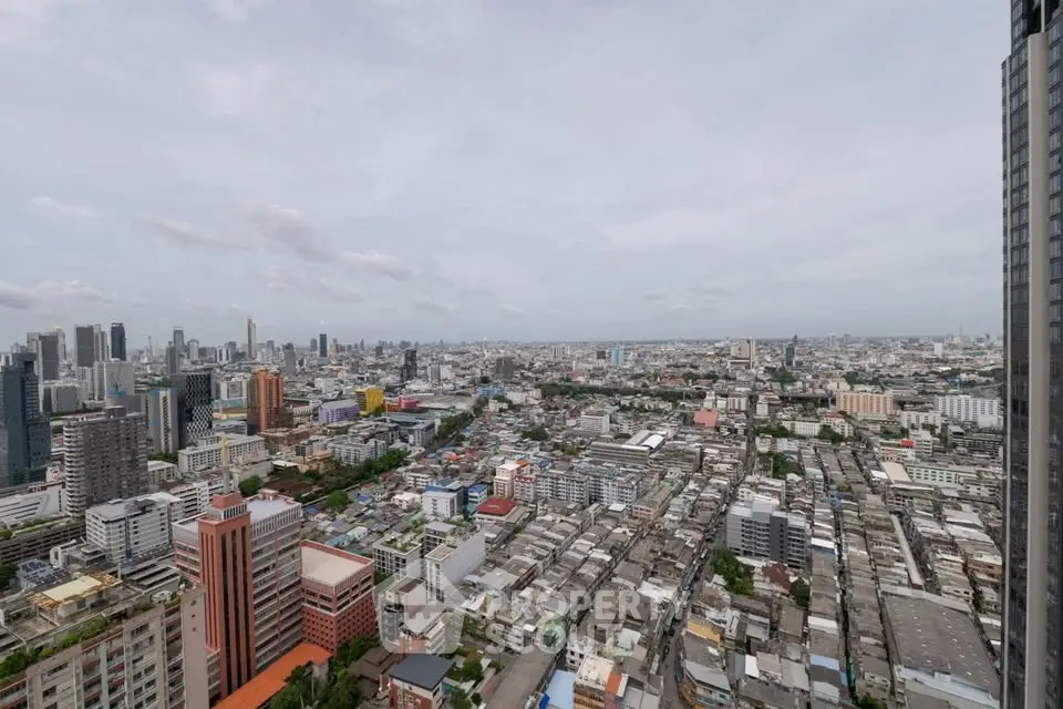 Stunning panoramic cityscape view from a high-rise building, showcasing urban skyline and vibrant city life.