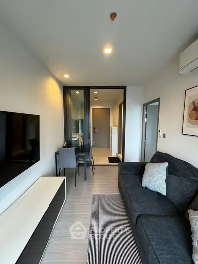 Modern living room with sleek furniture and open layout