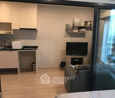 Modern studio apartment with open kitchen and cozy living area