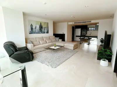 Spacious modern living room with elegant decor and open kitchen layout
