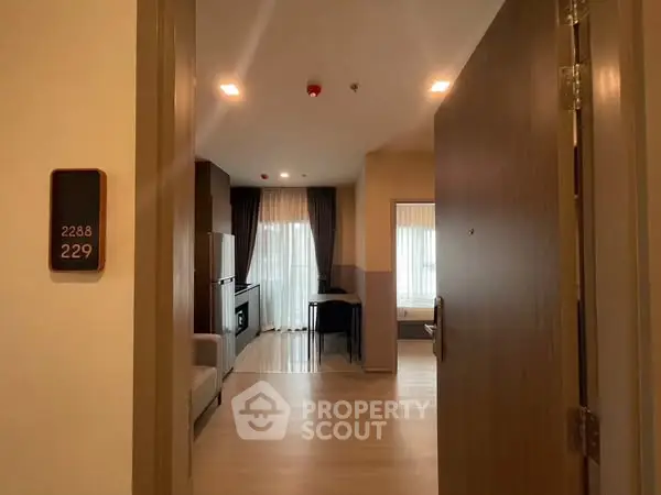 Modern apartment entrance with open view to living area and natural light