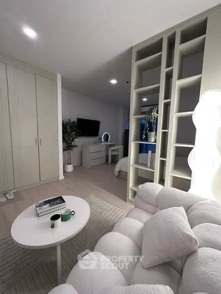 Modern living room with cozy white sofa and stylish decor