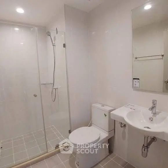 Modern bathroom with glass shower and sleek fixtures