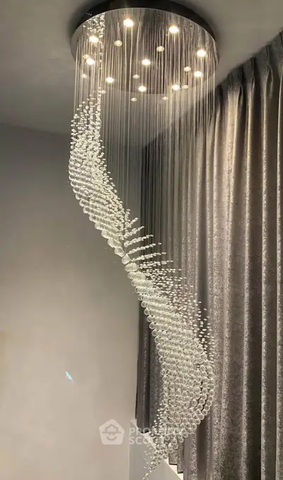 Elegant spiral crystal chandelier in modern interior setting