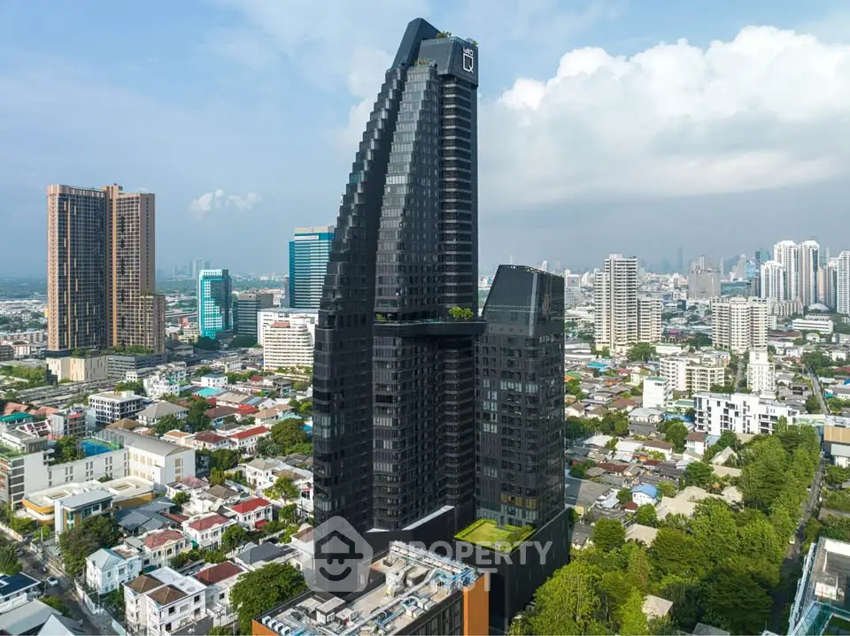Stunning aerial view of modern high-rise building in vibrant cityscape, showcasing architectural elegance and urban living.