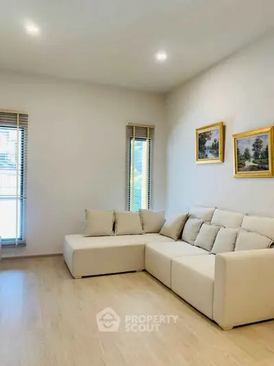 Modern living room with cozy beige sofa and elegant decor