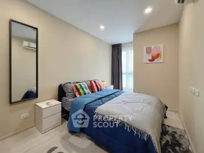 Modern bedroom with stylish decor and natural light