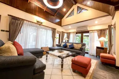 Spacious living room with high ceiling and elegant decor