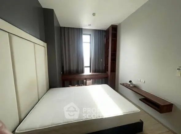 Modern bedroom with large window and minimalist furniture design