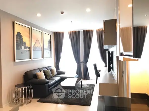 Modern living room with stylish decor and large windows in a luxury apartment.