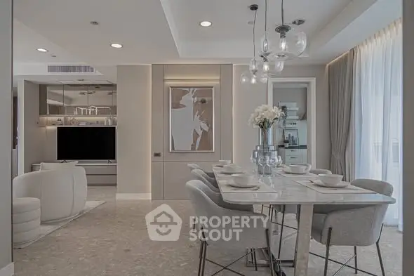 Elegant modern dining and living area with stylish decor and ample natural light.