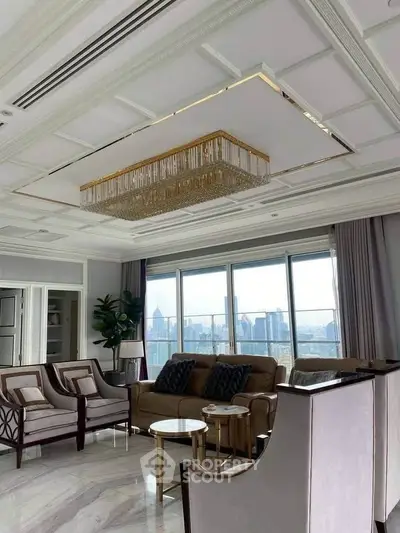 Luxurious living room with elegant chandelier and stunning city view