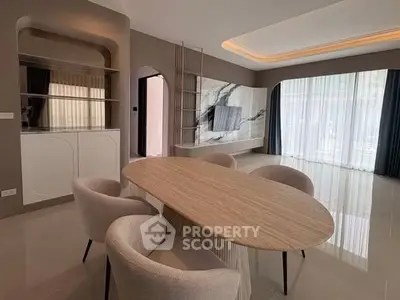 Elegant modern living room with stylish furniture and marble TV wall