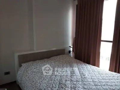 Cozy bedroom with soft lighting and elegant curtains, perfect for relaxation.