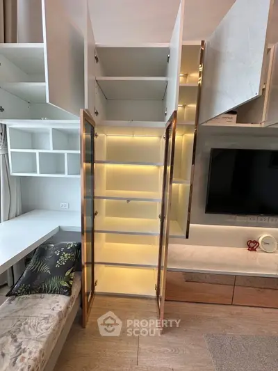 Modern living room with stylish open shelving and built-in storage solutions.