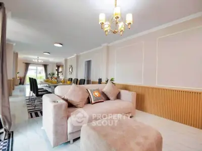 Spacious living room with elegant decor and ample natural light