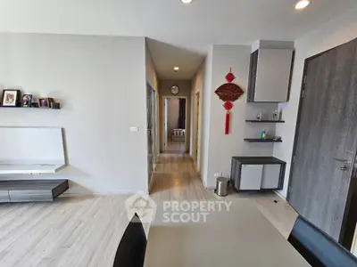 Modern living room with sleek furniture and decorative accents in a stylish apartment.