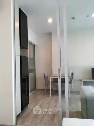 Modern apartment interior with sleek furniture and open layout design.