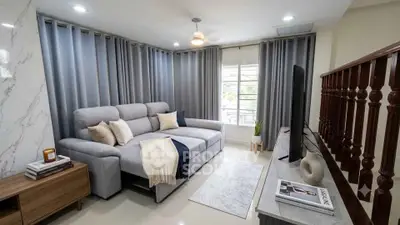Modern living room with stylish decor and large windows for natural light