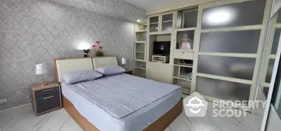 Spacious modern bedroom with elegant built-in storage and stylish decor