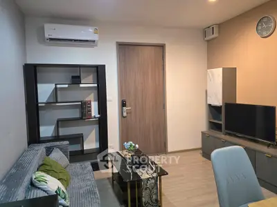 Modern living room with sleek furniture and air conditioning, perfect for comfortable urban living.